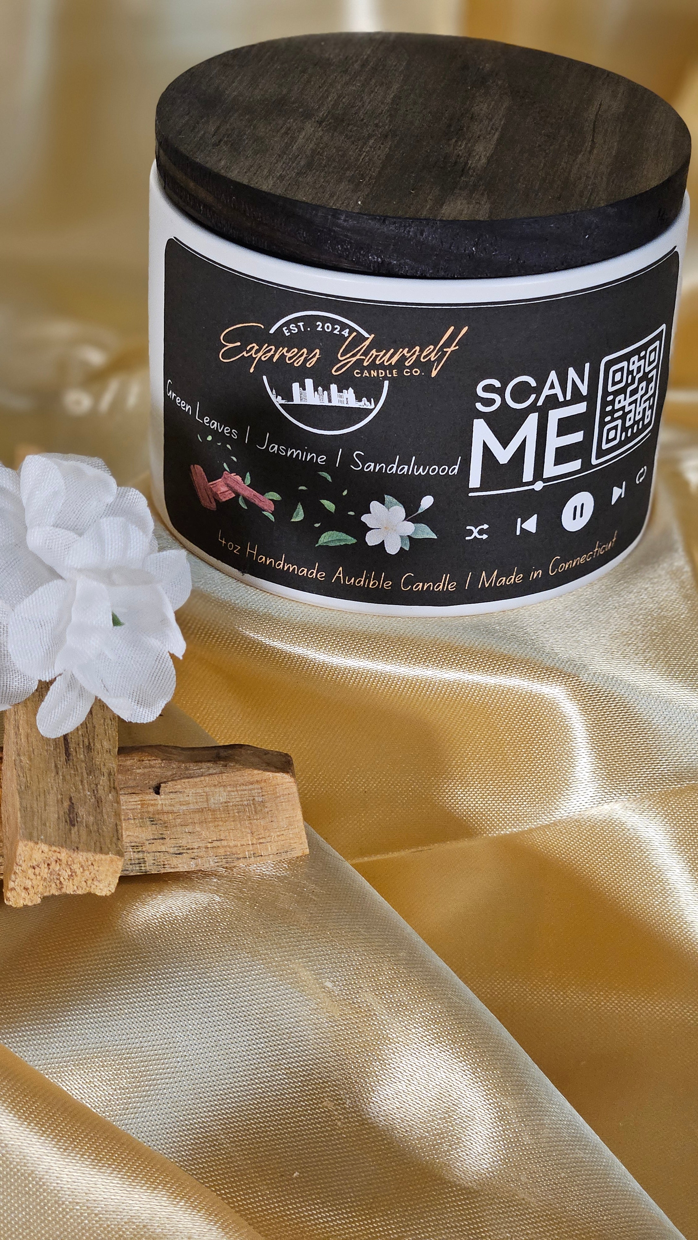 Mini Messenger personalized honeysuckle jasmine luxury candle with QR code audio experience on gold satin background.