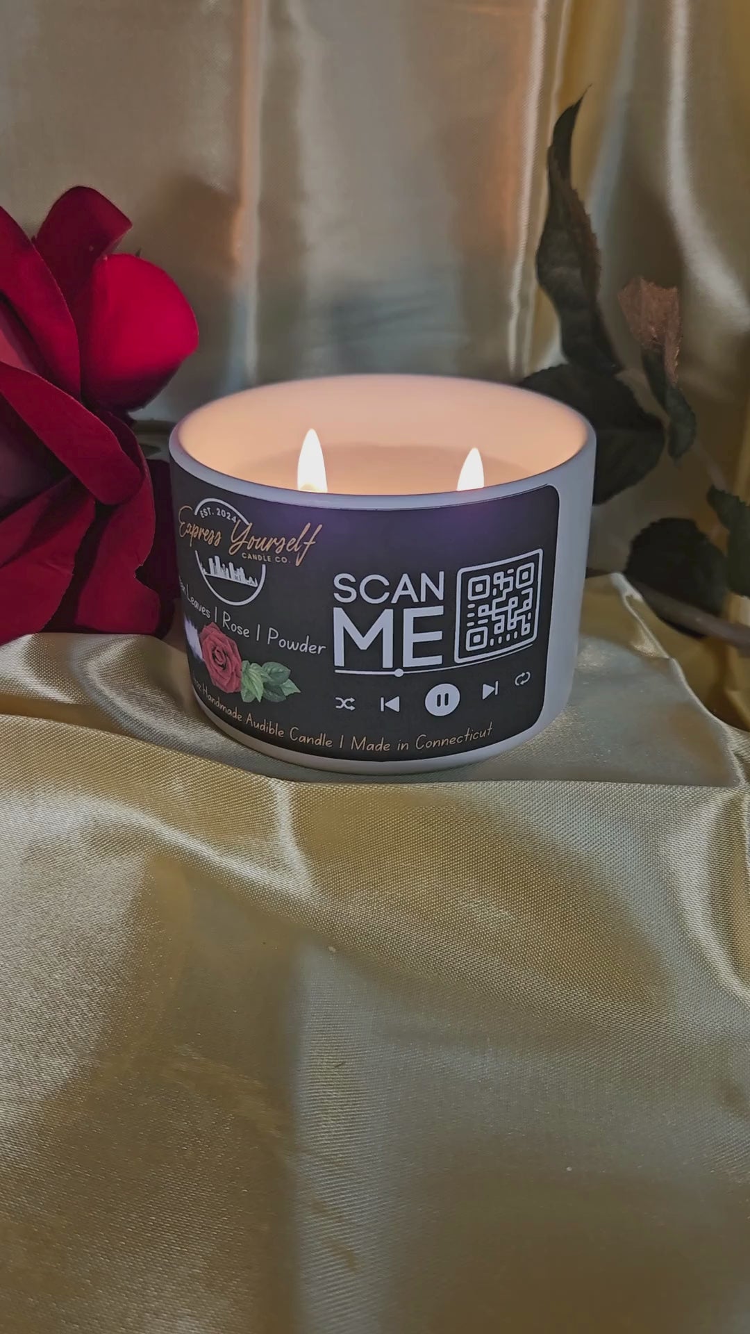 Mini Messenger personalized green leave and rose scented luxury candle with QR code audio experience on gold satin background.
